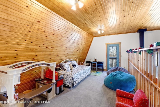 carpeted bedroom featuring wood ceiling, wooden walls, and vaulted ceiling