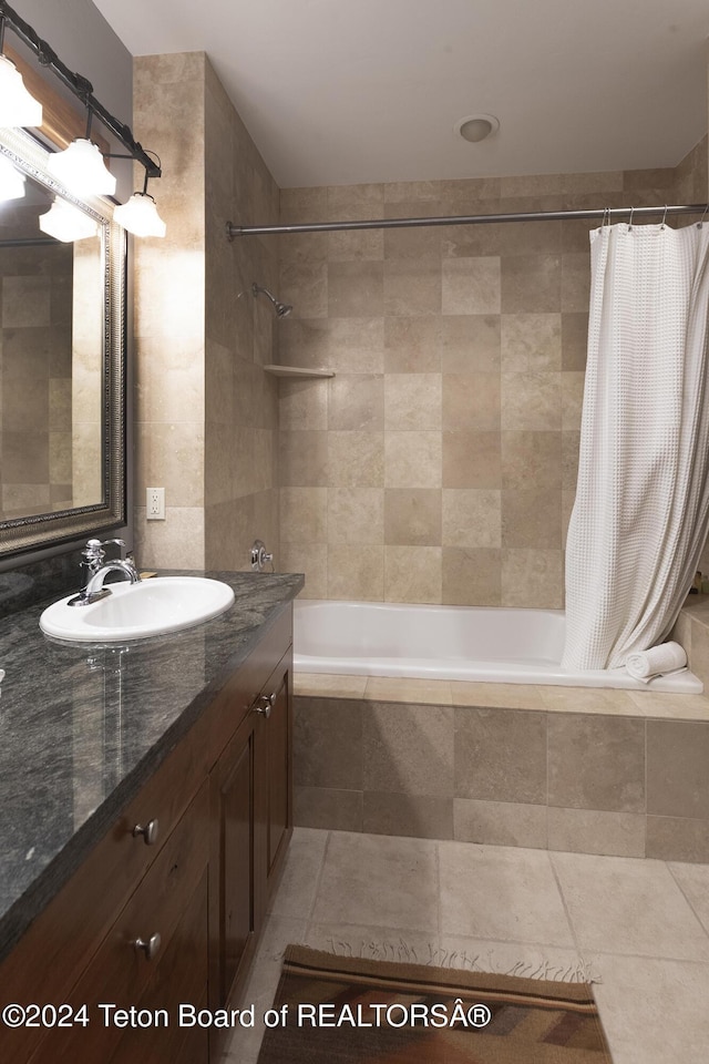 bathroom with tile patterned flooring, vanity, and shower / tub combo with curtain