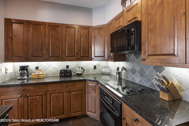 kitchen featuring tasteful backsplash and black appliances