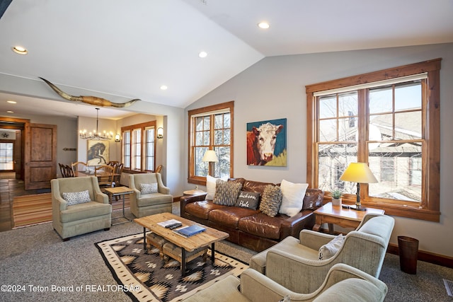 living room featuring lofted ceiling, carpet floors, a wealth of natural light, and an inviting chandelier