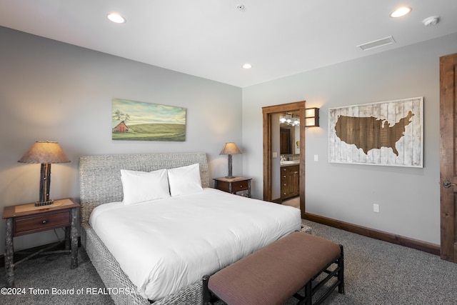 carpeted bedroom featuring connected bathroom