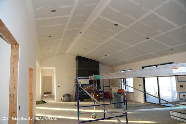 hallway with vaulted ceiling