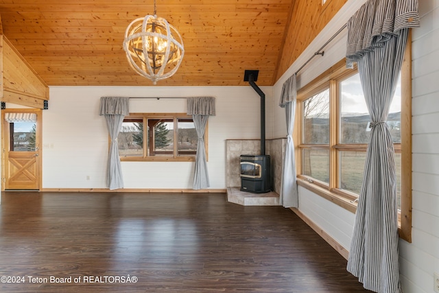 unfurnished living room with wooden ceiling, dark hardwood / wood-style floors, lofted ceiling, and a wood stove