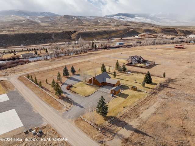 bird's eye view featuring a mountain view and a rural view