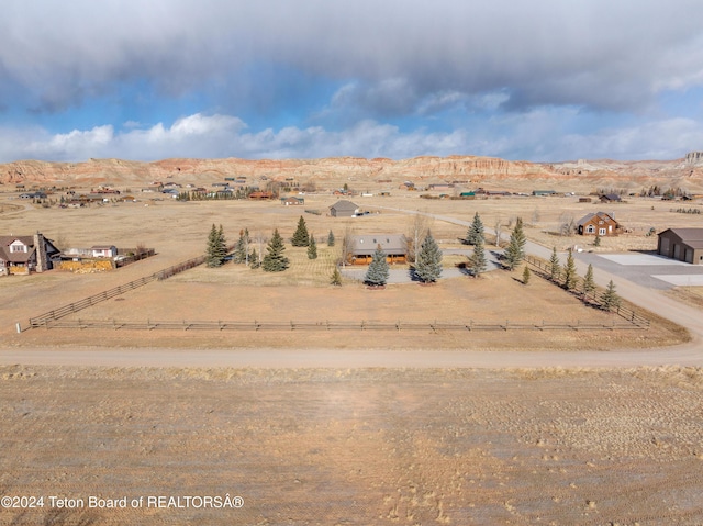 drone / aerial view with a mountain view and a rural view