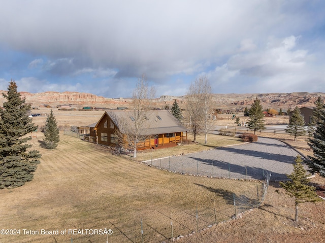 drone / aerial view featuring a mountain view and a rural view