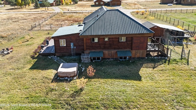 birds eye view of property with a rural view