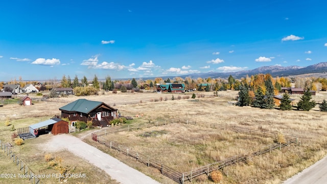 birds eye view of property with a mountain view and a rural view