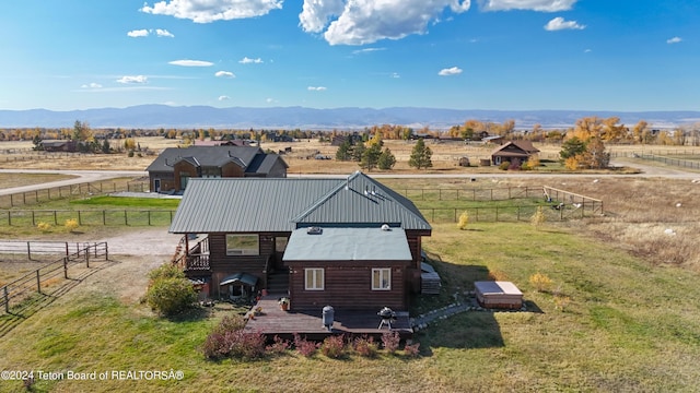 birds eye view of property featuring a mountain view and a rural view