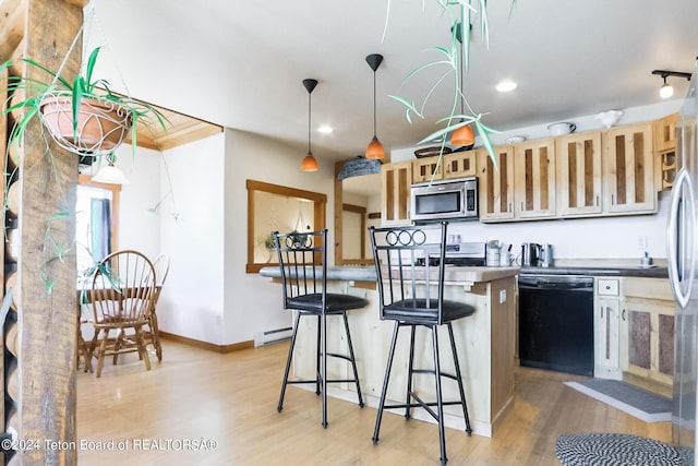 kitchen with appliances with stainless steel finishes, a breakfast bar, a baseboard radiator, light hardwood / wood-style floors, and hanging light fixtures