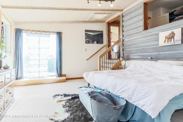 carpeted bedroom with lofted ceiling