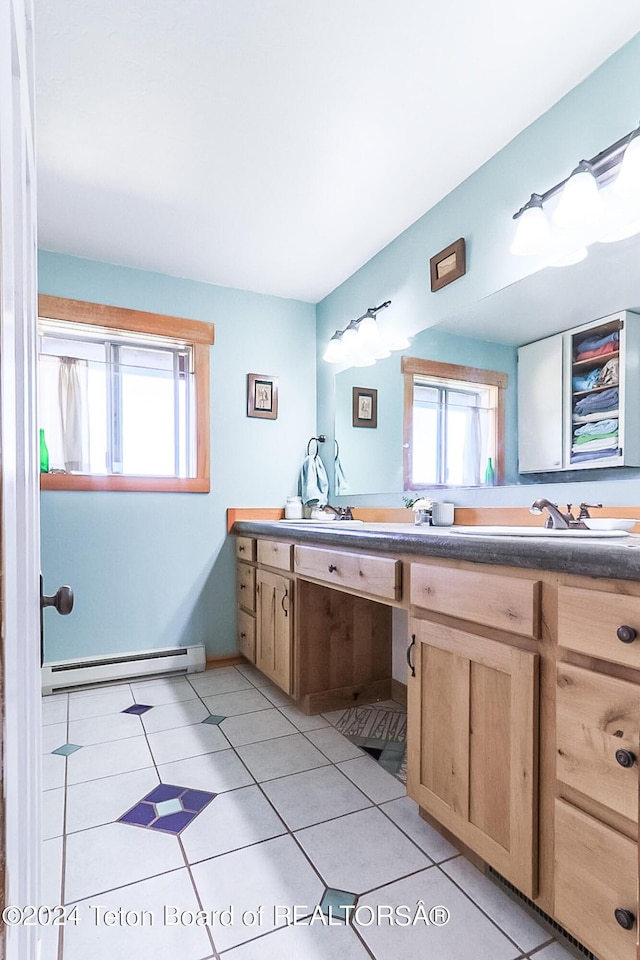 bathroom with tile patterned floors, plenty of natural light, and a baseboard radiator