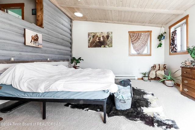 carpeted bedroom with lofted ceiling, baseboard heating, and wood ceiling