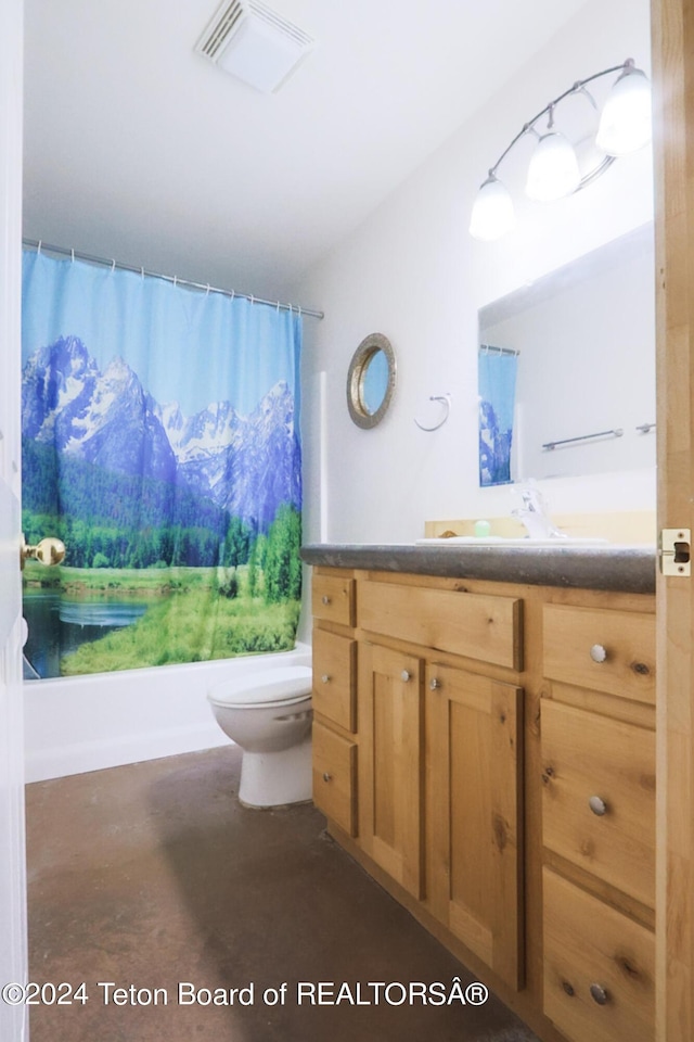 full bathroom with vanity, toilet, concrete floors, and shower / bath combo with shower curtain