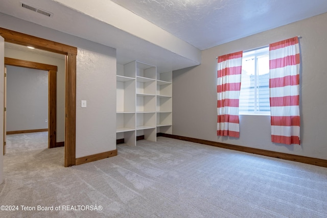 unfurnished bedroom with light carpet