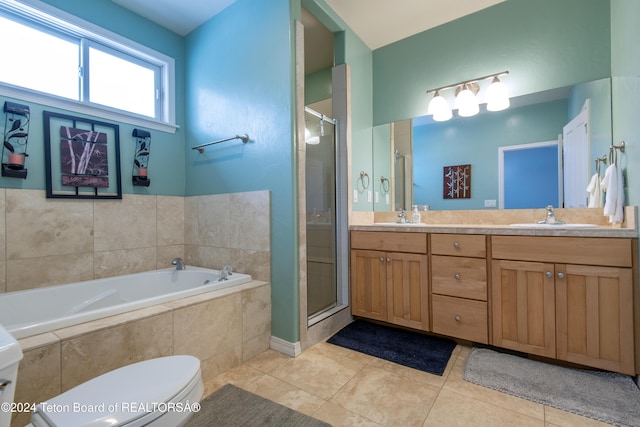 full bathroom featuring tile patterned flooring, vanity, toilet, and independent shower and bath