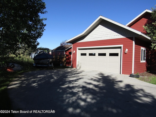 view of side of property featuring a garage