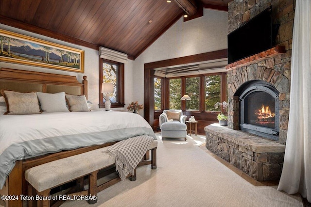 carpeted bedroom featuring a fireplace, beam ceiling, high vaulted ceiling, and wood ceiling