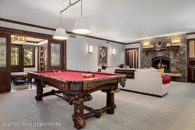 playroom with light colored carpet, ornamental molding, a fireplace, and billiards