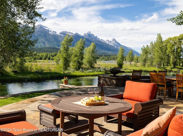 exterior space with a water and mountain view