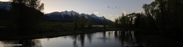 property view of water featuring a mountain view