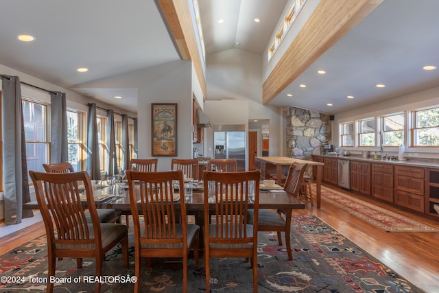 3470 W Mccollister Dr, Teton Village, WY 83025 - dining room featuring light wood finished floors, vaulted ceiling, and recessed lighting