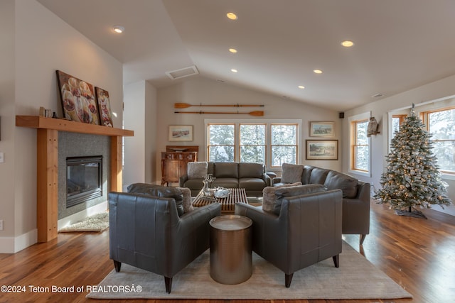 3470 W Mccollister Dr, Teton Village, WY 83025 - living area featuring wood finished floors, lofted ceiling, a tile fireplace, and recessed lighting