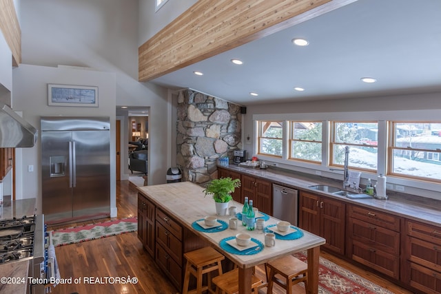 3470 W Mccollister Dr, Teton Village, WY 83025 - kitchen featuring appliances with stainless steel finishes, wood finished floors, recessed lighting, and brown cabinets