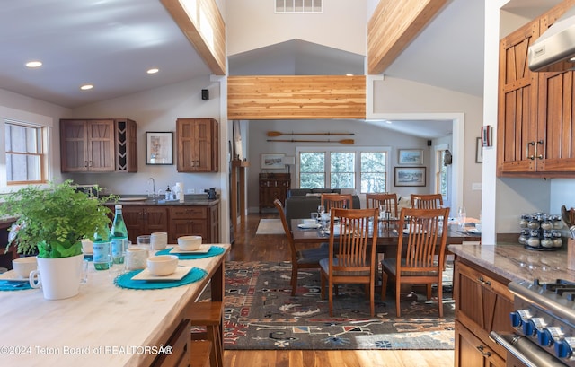 3470 W Mccollister Dr, Teton Village, WY 83025 - dining space featuring lofted ceiling, wood finished floors, plenty of natural light, and recessed lighting