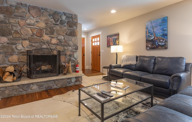 3470 W Mccollister Dr, Teton Village, WY 83025 - living area featuring wood finished floors, a stone fireplace, and recessed lighting