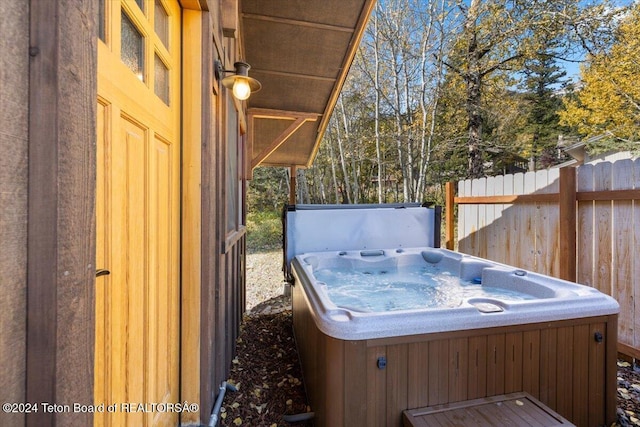 3470 W Mccollister Dr, Teton Village, WY 83025 - wooden terrace featuring a hot tub