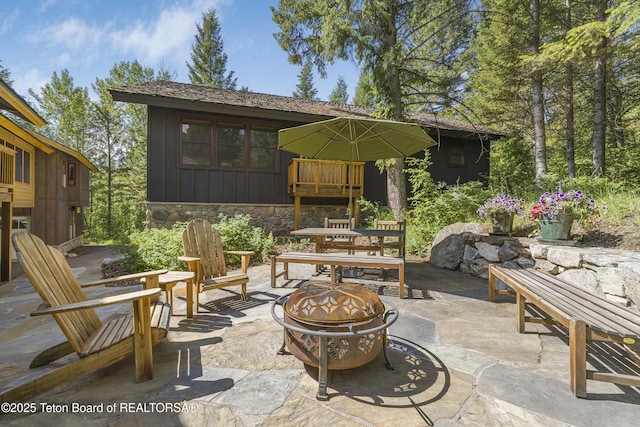 3470 W Mccollister Dr, Teton Village, WY 83025 - view of patio featuring an outdoor fire pit