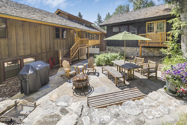 3470 W Mccollister Dr, Teton Village, WY 83025 - view of patio / terrace featuring an outdoor fire pit, a grill, and stairs
