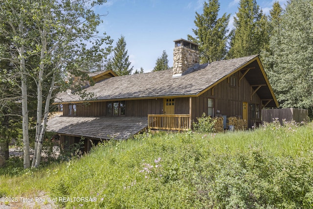 3470 W Mccollister Dr, Teton Village, WY 83025 - back of property featuring a chimney