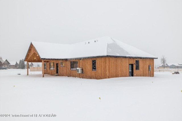 view of snow covered house