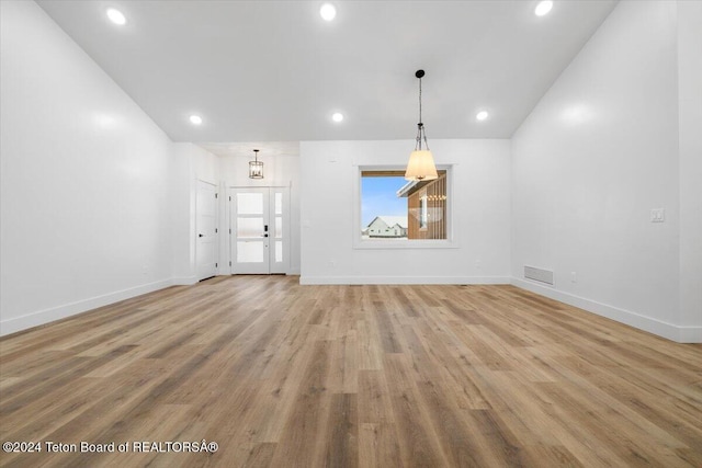 unfurnished living room with light wood-type flooring