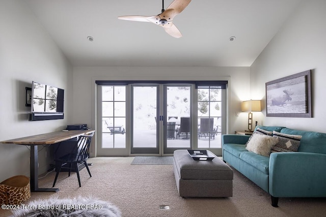 living room featuring carpet and lofted ceiling