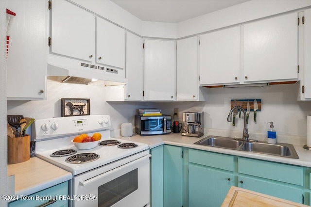 kitchen featuring white cabinets, white electric range oven, and sink