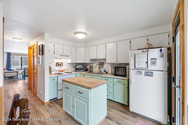 kitchen featuring sink, a kitchen island, light hardwood / wood-style flooring, white appliances, and white cabinets