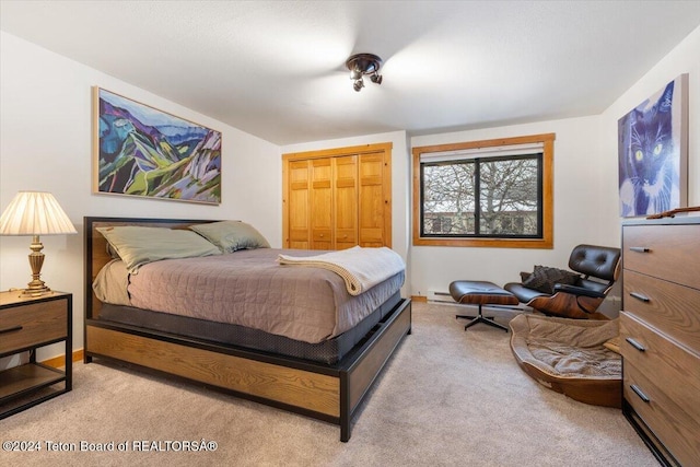 bedroom with light carpet and a closet