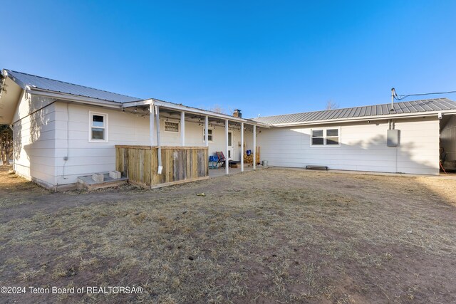 407 N 1st St, Dubois, WY 82513 - rear view of property with a metal roof