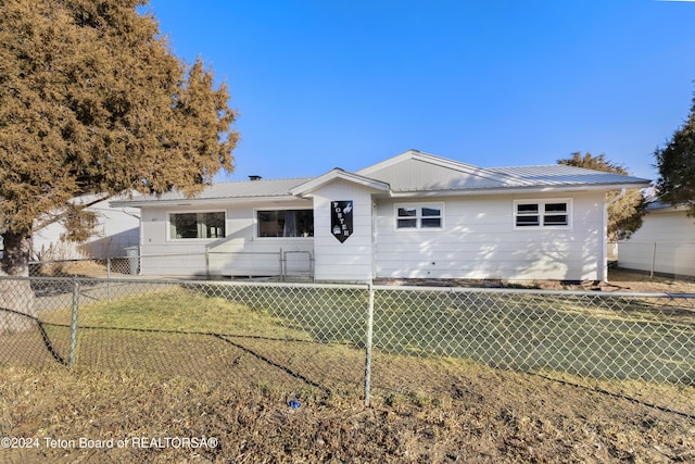 407 N 1st St, Dubois, WY 82513 - rear view of house with a metal roof