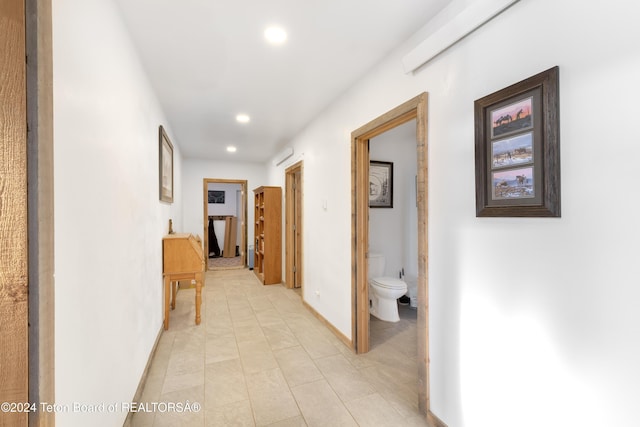 hallway with light tile patterned flooring