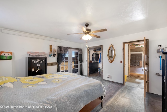 bedroom featuring a closet, ceiling fan, french doors, and dark wood-type flooring