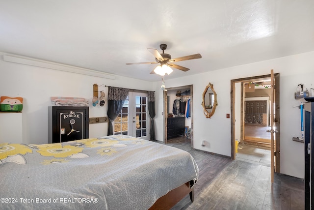 621 Mountain View Dr, Dubois, WY 82513 - bedroom featuring wood finished floors, french doors, a closet, a ceiling fan, and a spacious closet