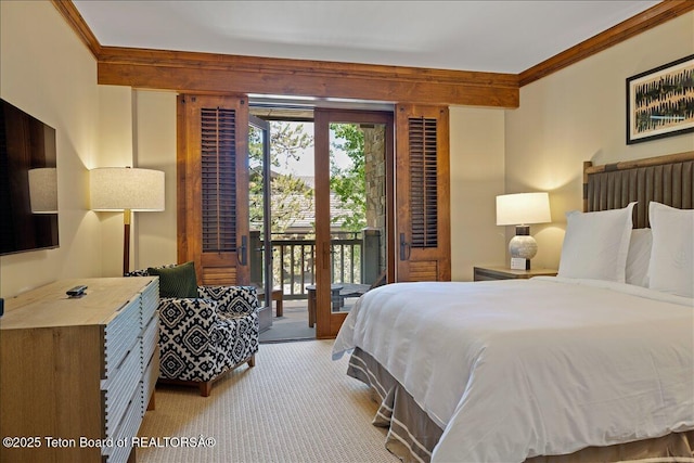 carpeted bedroom featuring access to outside and crown molding