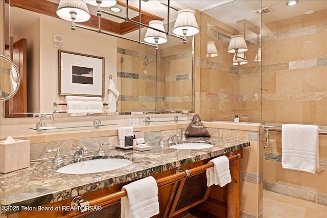 bathroom featuring vanity and an enclosed shower