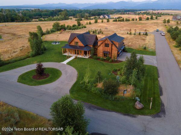 birds eye view of property featuring a mountain view