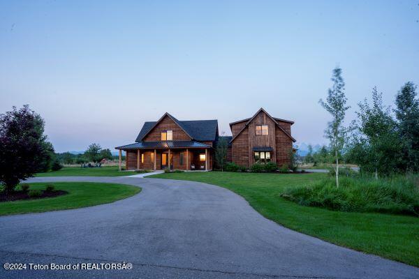 view of front of property with a yard