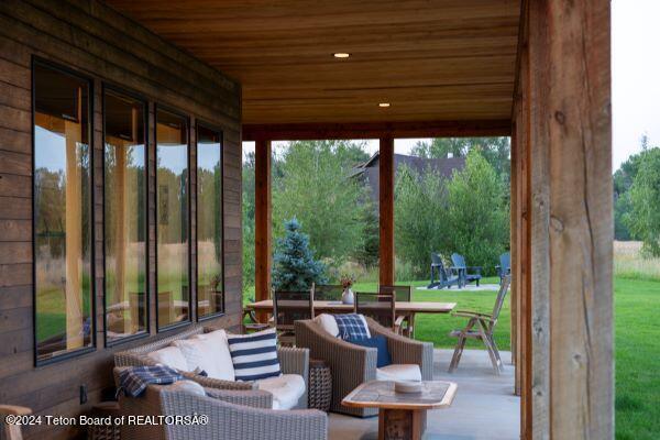 unfurnished sunroom featuring wood ceiling